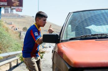 Hammoudi next to a car