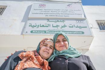 Two proud woman in front of their gym in jordan.