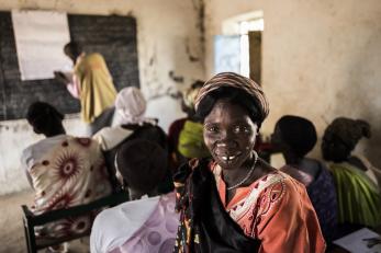 Woman smiling in south sudan classroom