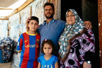 A husband, wife, daughter and son standing together in lebanon