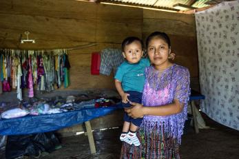 A woman holds a toddler in guatemala