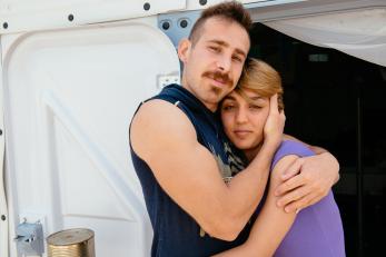 A young man and woman embracing