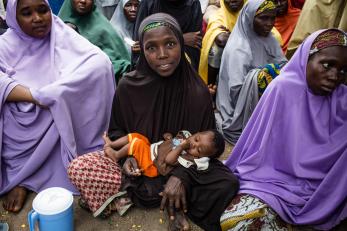 Nigerian mother and child in a group