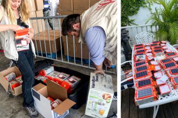 Mercy corps team members prepare solar lanterns for distribution