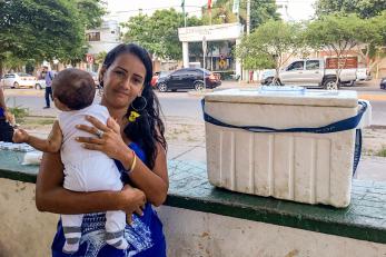 A young woman holds her baby in colombia