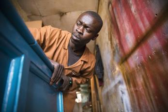 A man building furniture in kenya