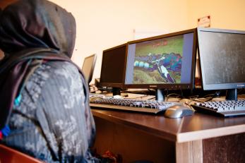 A syrian teenager uses a computer in a youth center in lebanon