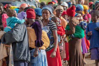 A crowd of people wearing colorful clothing in zimbabwe