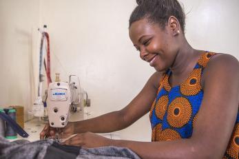 Young woman sewing