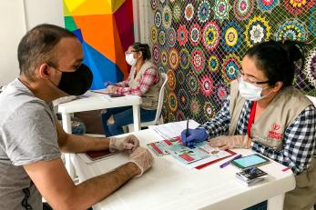 Mercy corps employee working with community member in colombia.