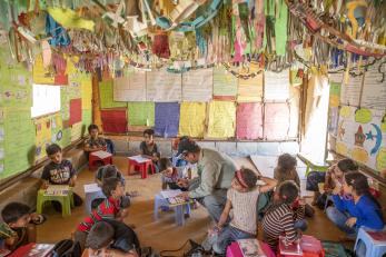 Ahmad, 51, teaches maths in the schoolhouse he built in the informal settlement where he lives in jordan