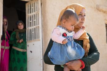 A person holding a baby.