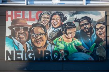 A painted mural of community members.