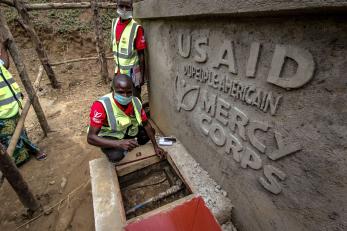 Construction of usaid and mercy corps signage.