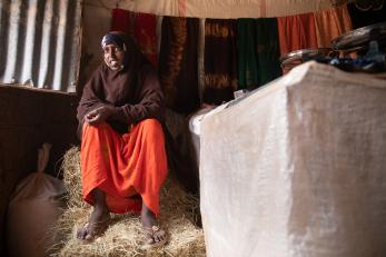 A person sitting on hay,