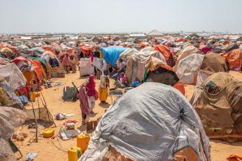 In a dusty lot on the outskirts of somalia’s capital city, mogadishu, displaced people live in a crowded camp.