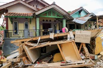 Damage and debris to a residence following an earthquake.