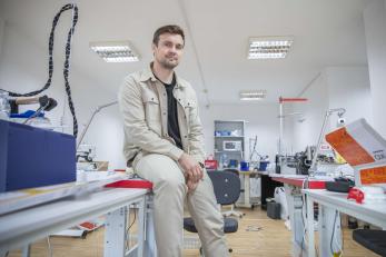 A person in their furniture workshop.