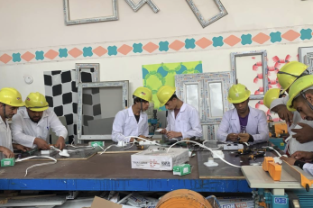 Participants learning electrical wiring at a vocational training.