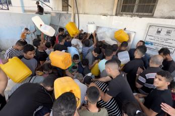 In khan younis, gazans wait their turn at a water point in january 2024.