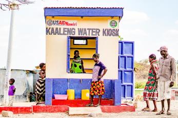 Community members fetching water from a usaid nawiri-rehabilitated water kiosk in kaaleng village, turkana county.