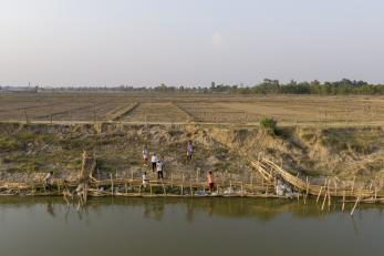 Nepalese community working on restoring riverbank.
