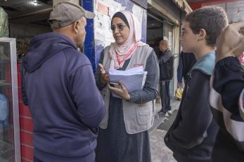 Mercy corps employee speaking with palestinians.