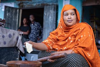 A woman sells food from a shop in ethiopia