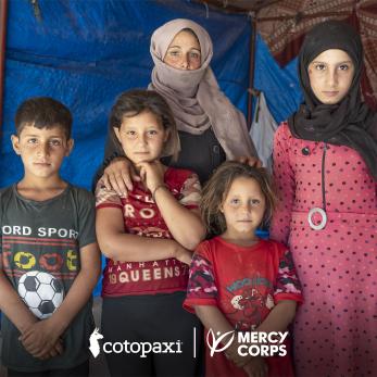 A family of five poses for the photograph