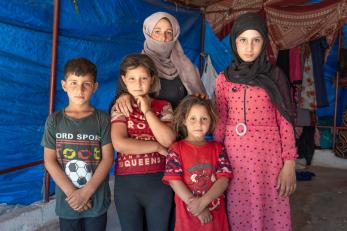 A family poses in syria