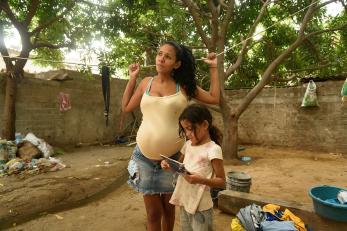 Martha, 27, and her daughter daenmarys, 8, in the parking lot of the building where she currently lives.