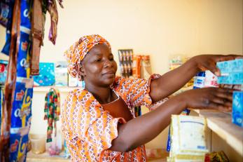 Nigerian woman staffing a store.