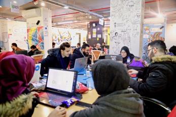 Group of young people working as their computers.