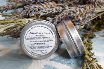 Skin care product and lavender bush flowers.