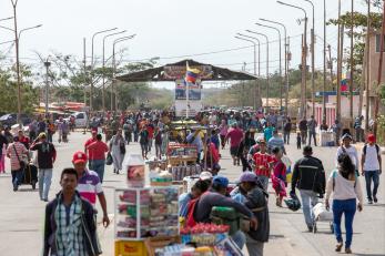 People walking between the colombia and venezuela borders