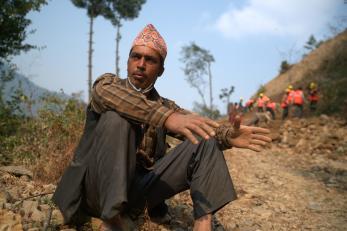 Nepalese man resting during road construction effort.