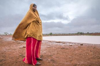 Woman standing near reservoir in kenya