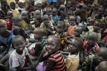 South sudanese children sitting in large group
