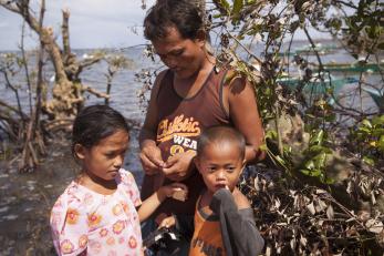 A father with two children in the phillipines