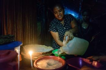 A woman preparing a meal in timor leste