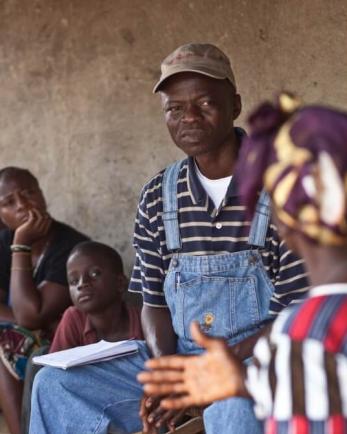 When the farmers work together, it’s better — and faster,” notes mercy corps program coordinator emmett freeman (pictured here talking to a mercy corps participant).