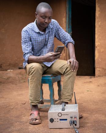 Brian mouti uses the sunculture solar-powered water pump to irrigate his crops.