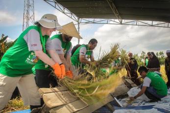 Mercy Corps employees doing agricultural work