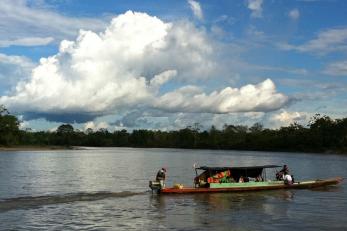 Mercy Corps team members and government officials on the way to Putamayo, deep in the Colombian jungle.