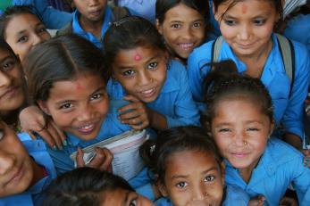 Girls smiling in blue uniforms