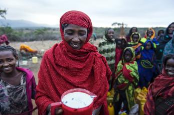 As a pastoralist in Ethiopia, Dima Halke relies on the milk her livestock produce to support her eight children. Photo: Sean Sheridan for Mercy Corps