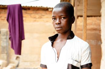 Boy in white shirt with black collar