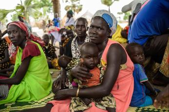 People and children sitting together in South Sudan