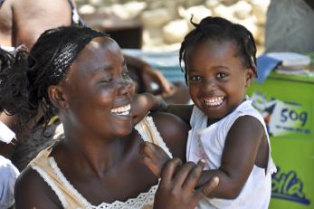 Woman holding a young girl