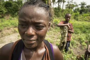 Ladylue standing in foreground; young boy in background